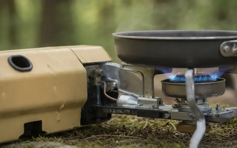 Frying pan heating on the focused blue flame of the Qinux GoFlamex outdoor stove